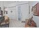 Bright entry foyer with white walls, tiled flooring, and decorated console table with art at 8120 E Cortez Dr, Scottsdale, AZ 85260