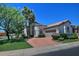 Street-level view of home with neutral exterior, manicured lawn, and a tiled roof in a suburban neighborhood at 8120 E Cortez Dr, Scottsdale, AZ 85260