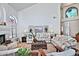 Cozy living room with lots of natural light, a fireplace, and comfortable seating arrangements at 8120 E Cortez Dr, Scottsdale, AZ 85260