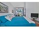 Bright main bedroom with sliding glass door access to an outdoor living space at 8120 E Cortez Dr, Scottsdale, AZ 85260