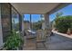 Covered patio with seating area surrounded by lush greenery and landscaping at 8120 E Cortez Dr, Scottsdale, AZ 85260