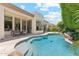 Beautiful backyard with a refreshing pool, patio dining area, and lush landscaping at 8216 E Angel Spirit Dr, Scottsdale, AZ 85255