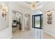 Bright foyer featuring marble floors, stylish lighting, and an arched doorway at 8216 E Angel Spirit Dr, Scottsdale, AZ 85255