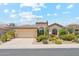 Attractive single-story home with a 2-car garage complemented by colorful desert landscaping at 8216 E Angel Spirit Dr, Scottsdale, AZ 85255