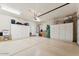 Spacious garage with ample storage cabinets and epoxy flooring at 8216 E Angel Spirit Dr, Scottsdale, AZ 85255