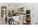 Spacious kitchen featuring white cabinets, a large island, stainless steel appliances, and stylish bar stool seating at 8216 E Angel Spirit Dr, Scottsdale, AZ 85255