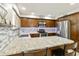 A closer view of the kitchen showing granite countertops, modern backsplash, and stainless steel appliances at 922 S Ember Cir, Mesa, AZ 85208
