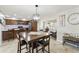 Open floor plan view of the kitchen and dining room leading to a living space at 922 S Ember Cir, Mesa, AZ 85208