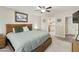 Relaxing main bedroom boasts a ceiling fan, a carpet floor, and an attached bathroom at 922 S Ember Cir, Mesa, AZ 85208