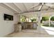 Well-equipped outdoor kitchen with a built-in grill, sink, and ample counter space for entertaining at 922 S Ember Cir, Mesa, AZ 85208
