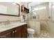 Upgraded shower offers glass enclosure, sleek fixtures, and designer-inspired tiling at 922 S Ember Cir, Mesa, AZ 85208