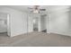 Spacious bedroom with ceiling fan and a doorway to a closet or additional room at 923 E Agua Fria Ln, Avondale, AZ 85323