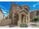 Charming two-story home featuring a covered entryway and well-maintained desert landscaping at 923 E Agua Fria Ln, Avondale, AZ 85323