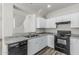 This kitchen features granite countertops, stainless steel sink, and black appliances at 923 E Agua Fria Ln, Avondale, AZ 85323