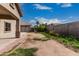 Spacious backyard featuring a covered patio area and a block perimeter wall for privacy at 9325 W Elwood St, Tolleson, AZ 85353