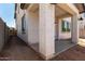 A cozy covered back patio provides a transition to the backyard and a nice spot for outdoor relaxation at 9408 E Sequence Ave, Mesa, AZ 85212