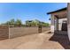 A private backyard with block wall and gate, perfect for pets or a quiet garden retreat at 9408 E Sequence Ave, Mesa, AZ 85212