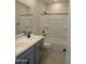 Bathroom featuring double sink vanity, modern fixtures, and shower-tub combo at 9408 E Sequence Ave, Mesa, AZ 85212
