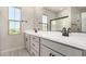Bathroom featuring dual sinks, quartz counters, and matte black fixtures at 9408 E Sequence Ave, Mesa, AZ 85212