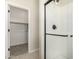 Modern bathroom featuring a walk-in shower with sleek glass door and matte black hardware at 9408 E Sequence Ave, Mesa, AZ 85212