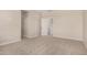 Carpeted bedroom featuring multiple doors and ample space at 9408 E Sequence Ave, Mesa, AZ 85212