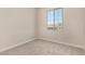 Neutral bedroom with carpet, a window letting in natural light, and ample wall space at 9408 E Sequence Ave, Mesa, AZ 85212
