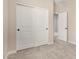 Bedroom with carpet, closet doors, and doorways to other rooms in the house at 9408 E Sequence Ave, Mesa, AZ 85212