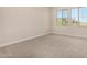 Bright carpeted bedroom with ample natural light from windows at 9408 E Sequence Ave, Mesa, AZ 85212