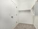 Walk-in closet featuring ample shelving and storage space for an organized wardrobe at 9408 E Sequence Ave, Mesa, AZ 85212