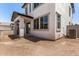 A newly constructed stucco home with a covered patio, offering modern design and outdoor living at 9408 E Sequence Ave, Mesa, AZ 85212