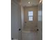 Functional laundry room with tile floors and a bright window at 9408 E Sequence Ave, Mesa, AZ 85212