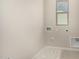 Bright laundry room with natural light and modern connections at 9408 E Sequence Ave, Mesa, AZ 85212