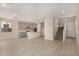 Open-concept living space with kitchen and staircase at 9408 E Sequence Ave, Mesa, AZ 85212