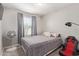 Bedroom with large window, neutral walls, and comfortable furnishings provides a relaxing space at 9412 S 34Th Dr, Laveen, AZ 85339