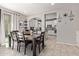 Elegant dining room with a large table, stylish decor, and seamless flow into the kitchen at 9412 S 34Th Dr, Laveen, AZ 85339