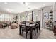 Open-concept dining area featuring a large table and access to the living room, perfect for entertaining at 9412 S 34Th Dr, Laveen, AZ 85339