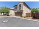 Front exterior of a two-story home featuring a two car garage and low maintenance landscaping at 9412 S 34Th Dr, Laveen, AZ 85339