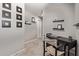 A cozy hallway space featuring neutral walls with display shelves and carpeted flooring at 9412 S 34Th Dr, Laveen, AZ 85339