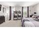 A spacious main bedroom featuring neutral carpet, stylish furniture, and natural light at 9412 S 34Th Dr, Laveen, AZ 85339