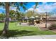 Community playground with a variety of play structures and green space at 9412 S 34Th Dr, Laveen, AZ 85339