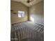Cozy bedroom features carpet flooring, a window for natural light, and a ceiling fan at 1010 N Osprey Ct, Gilbert, AZ 85234