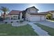 Well-maintained home with three car garage, landscaped front yard, and a tile roof at 1010 N Osprey Ct, Gilbert, AZ 85234