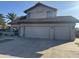Charming home featuring a three-car garage and beautifully maintained landscaping at 1010 N Osprey Ct, Gilbert, AZ 85234