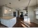 Bright kitchen with white cabinets, stone countertops, and stainless steel appliances, offering ample counter space at 1010 N Osprey Ct, Gilbert, AZ 85234