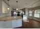 Beautiful kitchen featuring white cabinets, stone countertops, stainless steel appliances, and a tiled backsplash at 1010 N Osprey Ct, Gilbert, AZ 85234