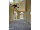 Bright living room features high ceilings, large windows, and plush carpeting at 1010 N Osprey Ct, Gilbert, AZ 85234