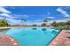 Expansive pool with sundeck and palm trees at 1010 N Osprey Ct, Gilbert, AZ 85234