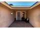 Inviting entryway with brick pavers, seating, and charming decor at 10211 W Hazelwood Ave, Phoenix, AZ 85037