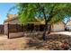 Charming single-story home featuring a private, gated courtyard with decorative fence at 10211 W Hazelwood Ave, Phoenix, AZ 85037
