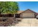 Charming single-story home featuring a private, gated courtyard and a two-car garage at 10211 W Hazelwood Ave, Phoenix, AZ 85037